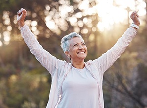 Smiling older woman enjoying a walk outside